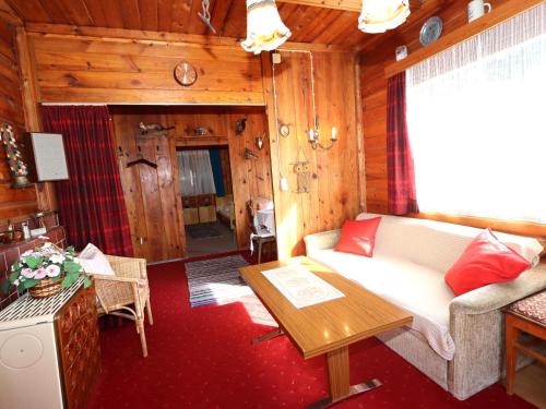 a living room with a couch and a table at Chalet Westermeyr in Mieming