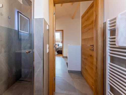 a bathroom with a shower and a glass door at Mountain Chalet Esttes in Sankt Lorenzen ob Murau