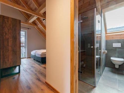 a bathroom with a shower and a toilet at Mountain Chalet Dahoam in Sankt Lorenzen ob Murau