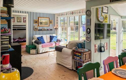 a living room with a couch and a table at Amazing Home In Græsted With Wifi in Græsted