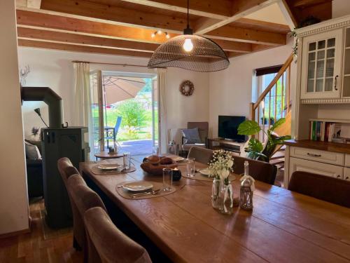 a large wooden table in a kitchen with a dining room at Casa Nostra in Kötschach