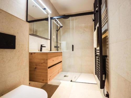 a bathroom with a shower and a sink at Be Durbuy in Durbuy