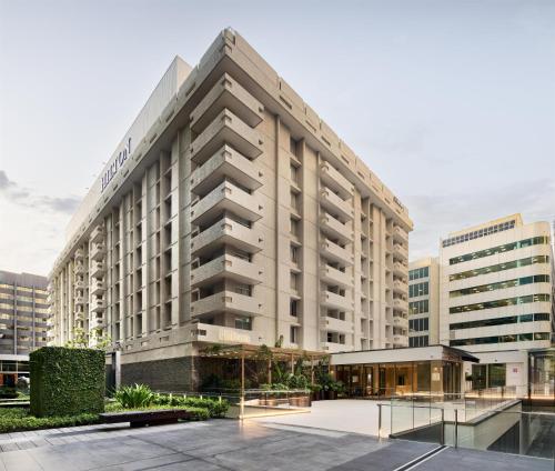 a rendering of a building with a courtyard at Parmelia Hilton Perth in Perth