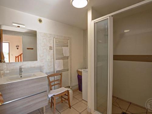 a bathroom with a sink and a glass shower at Gîte 4 pers avec jardin privé et animaux admis - FR-1-496-66 in Les Salles