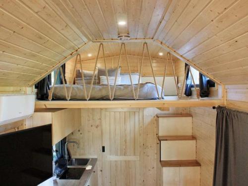 an inside view of a tiny house with a bed at Sugar Hut by Tiny Away in Great Horkesley