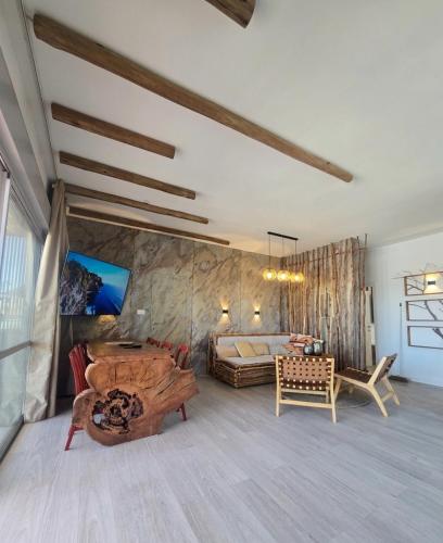 a large room with a bed and a couch at למרגלות הגלבוע in Gid‘ona
