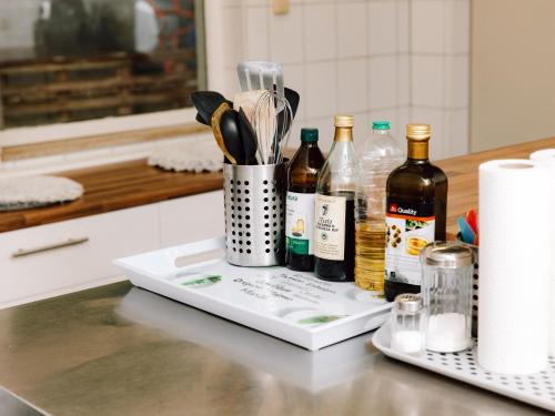 a counter top with bottles of wine and utensils at Friedensthal in Bad Pyrmont