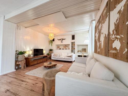 a living room with a couch and a table at Münstermaifeld in Münstermaifeld