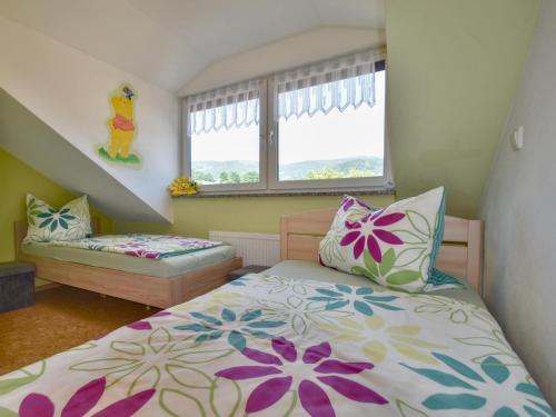 a small bedroom with a bed and a window at Gleißenberg in Gleißenberg