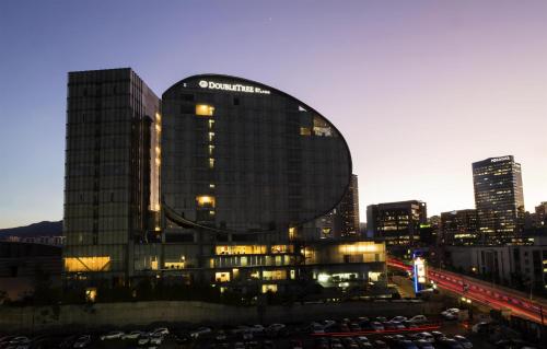 a building with a lot of cars parked in front of it at Doubletree By Hilton Mexico City Santa Fe in Mexico City