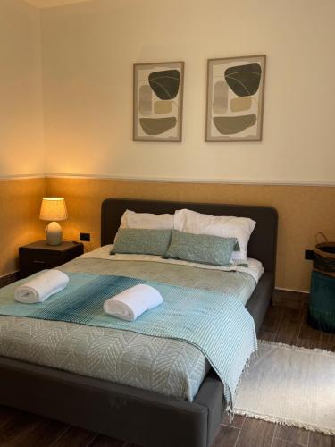 a bedroom with a bed with two pillows on it at Luxury 3-Bedroom Penthouse, Punta Cana, Pool-BBQ-Beach Access-Private Rooftop-Padel in Punta Cana