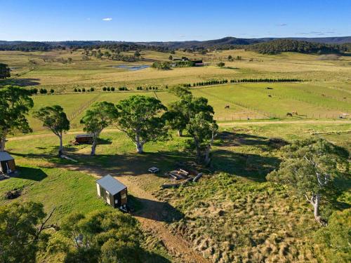 an aerial view of a farm with trees and a shed at Myrtle at Lexington Park in Tarlo