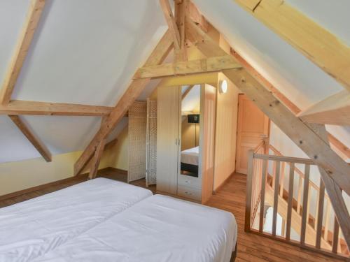 a bedroom with a bed in a attic at Lac Bleu Nr 38 in Lacapelle-Marival