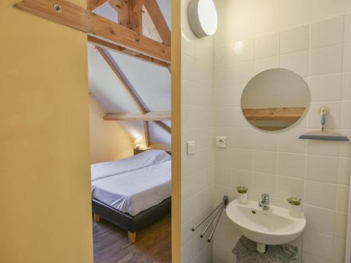 a bathroom with a sink and a bed in a room at Lac Bleu Nr 38 in Lacapelle-Marival