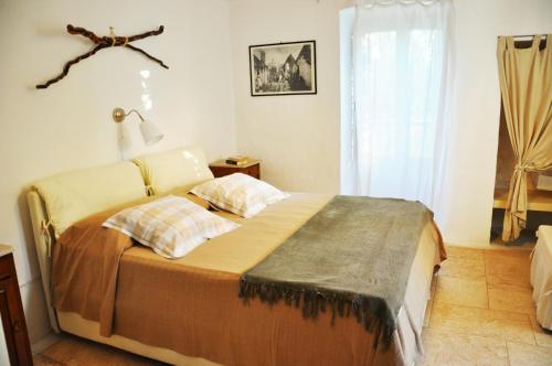 Voodi või voodid majutusasutuse PalmaFlora villa con trulli toas