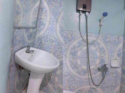 a bathroom with a sink and a shower at Verde Royale Resort in Calasiao