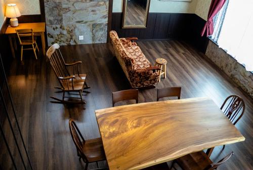 an overhead view of a dining room with a table and chairs at Taisho Roman-style Private Villa with Original Japanese Art 日本画原画の一棟貸し M's Lumos in Marugame