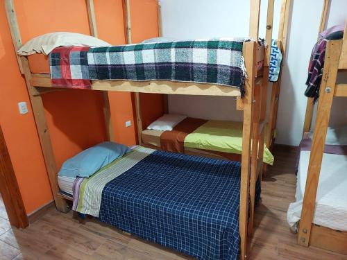 a couple of bunk beds in a room at Las Armonías Hostal in Panajachel