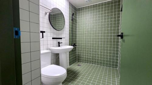 a bathroom with a toilet and a sink at 호텔 도토리 in Gunsan-si