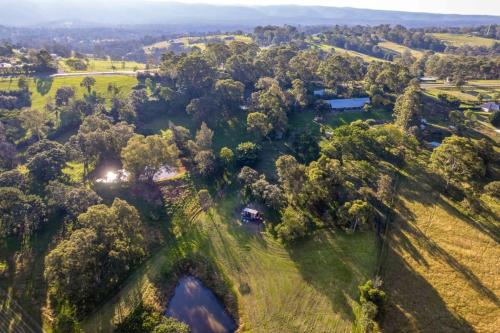 an aerial view of a field with trees at Tiny Inja 2 by Tiny Away in Comleroy