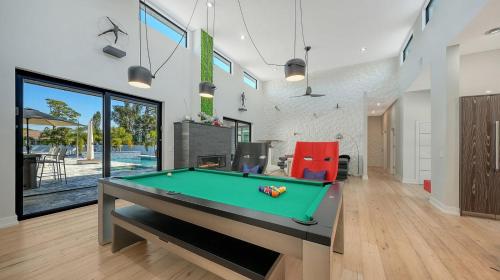 a billiard room with a pool table in a house at Stay & Play Sarasota in Sarasota