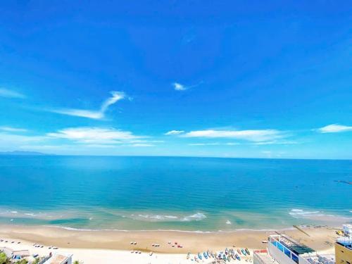 a view of a beach with people in the water at ZoZo House - Homestay Bai Sau - bien Vung Tau in Vung Tau