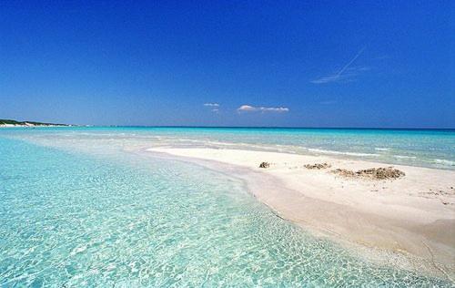 a beach with clear blue water and white sand at Felline In Bed&Breakfast Dimora di Charme el Salento in Felline