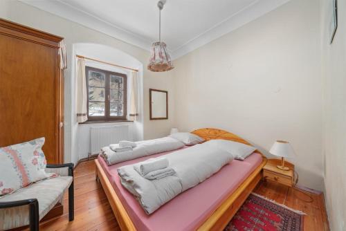 a room with two beds in it with a couch at Schloss Berg Klösterle in Zedlitzdorf