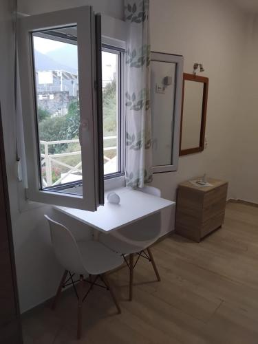 a bathroom with a sink and a window at Sea View Studios, Harbour Beach, Bali in Bali