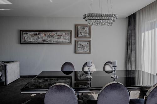 a dining room with a table and chairs at Willa Port in Ostróda