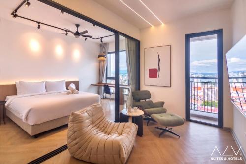 a hotel room with a bed and a balcony at 22 Macalisterz by ALV in George Town