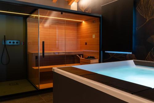 a bathroom with a glass shower and a sink at BORGO STALIS RESORT in Sesto al Reghena