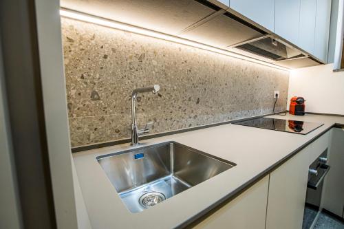a kitchen with a sink and a counter top at La Ca di Nosee in Nesso