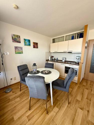 a kitchen and dining room with a table and chairs at Panoramic - Wanderlust #329 mit Schwimmbad in Hohegeiß