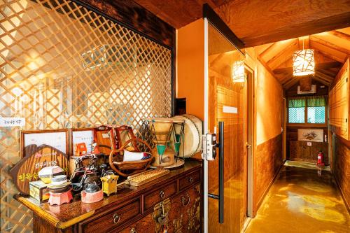 a kitchen with a counter with many items on it at Ddlanchae Guesthouse - New Tower in Jeonju
