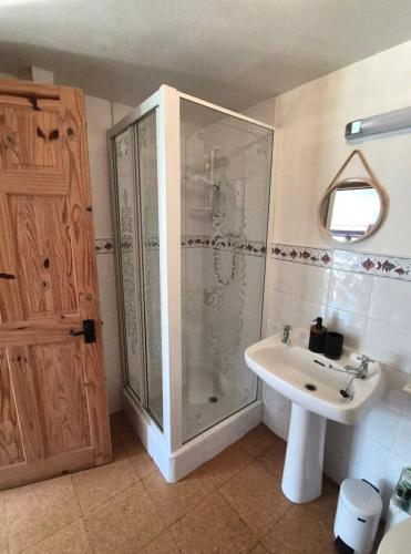a bathroom with a shower and a sink at Dean Linhay in Lynton