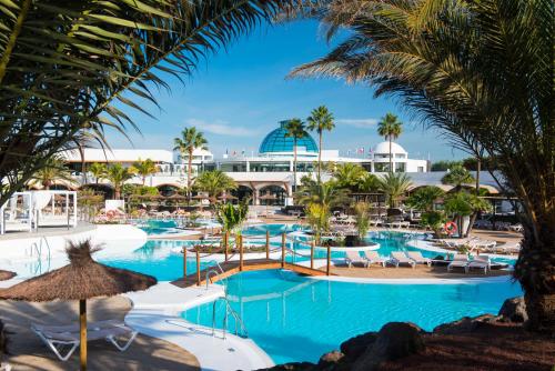 a view of the pool at a resort at Elba Lanzarote Royal Village Resort in Playa Blanca