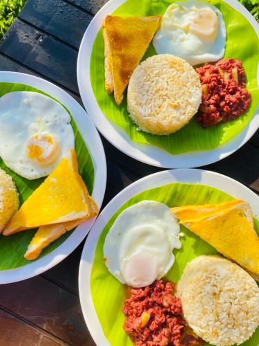a group of plates of food on a table at Itawis Resort - Balai Angel in Silang