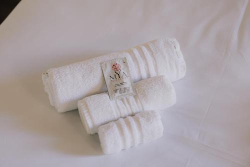 a group of white towels sitting on a table at Cavour Luxury Apartments in Verona