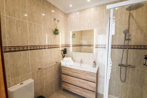 a bathroom with a sink and a shower at Sea Breeze Arguineguin in Mogán