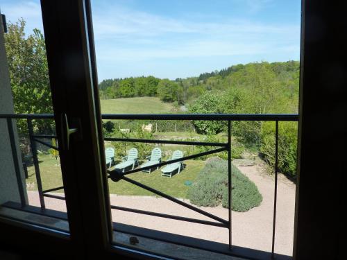 a view from a window with a view of a park at L'Hirondelle Chambres d'Hotes in Saint-Mathieu