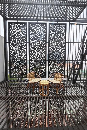 a table and two chairs sitting on a patio at HomeAi Apartment - Binh Thanh near Landmark 81 in Ho Chi Minh City