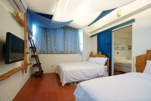 Giường trong phòng chung tại Rose Rider Guesthouse