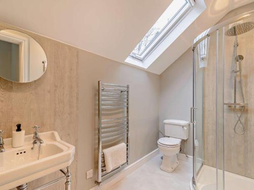 a bathroom with a toilet and a sink and a shower at 1 Bed in Ilkley oc-87569 in Ilkley