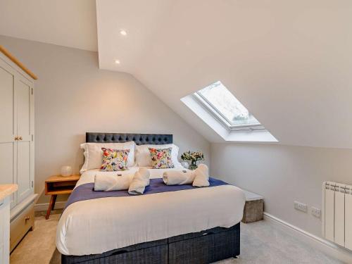 a bedroom with a large bed with a skylight at 1 Bed in Ilkley oc-87569 in Ilkley