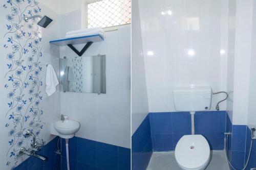 a blue and white bathroom with a toilet and a sink at Hotel Amrapali UDAIPUR BEST GORUP BOOKING HOTEL NEAR CA CIRCLE in Udaipur