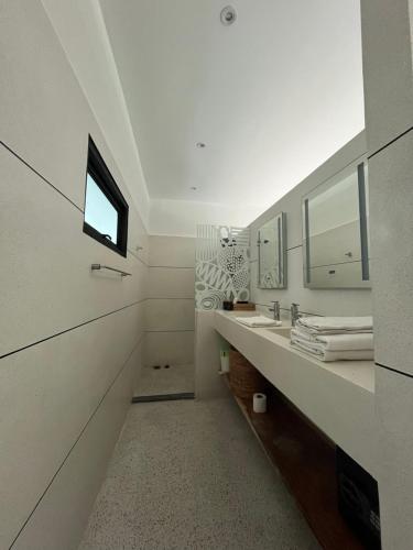 a bathroom with a sink and a mirror at Maprao Villa in Mae Nam