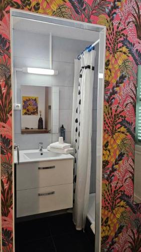 a bathroom with a sink and a mirror at Interlaken in Nice