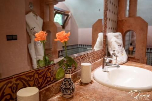a bathroom counter with a sink and a mirror at Ryad Salama in Fez