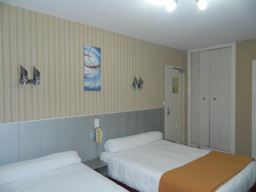 En eller flere senge i et værelse på L'Elancèze